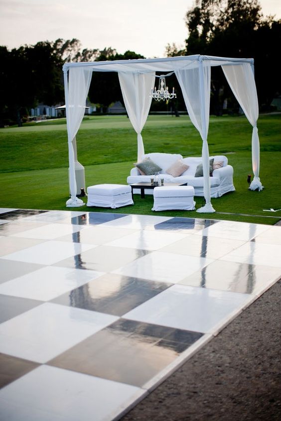 Outdoor dance floor and pipe and drape for wedding booth show